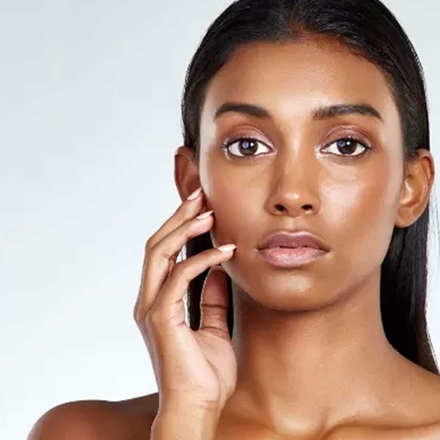 woman posing and touching her face