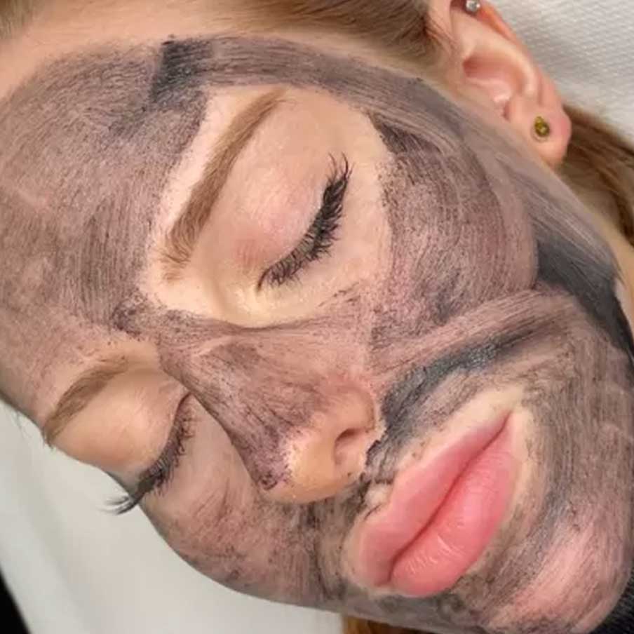woman wearing a cosmetic peeling face mask